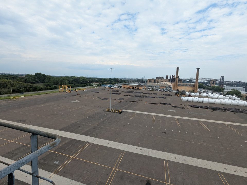 Marine terminal storage yard and rail cars seen from high on a harbor crane